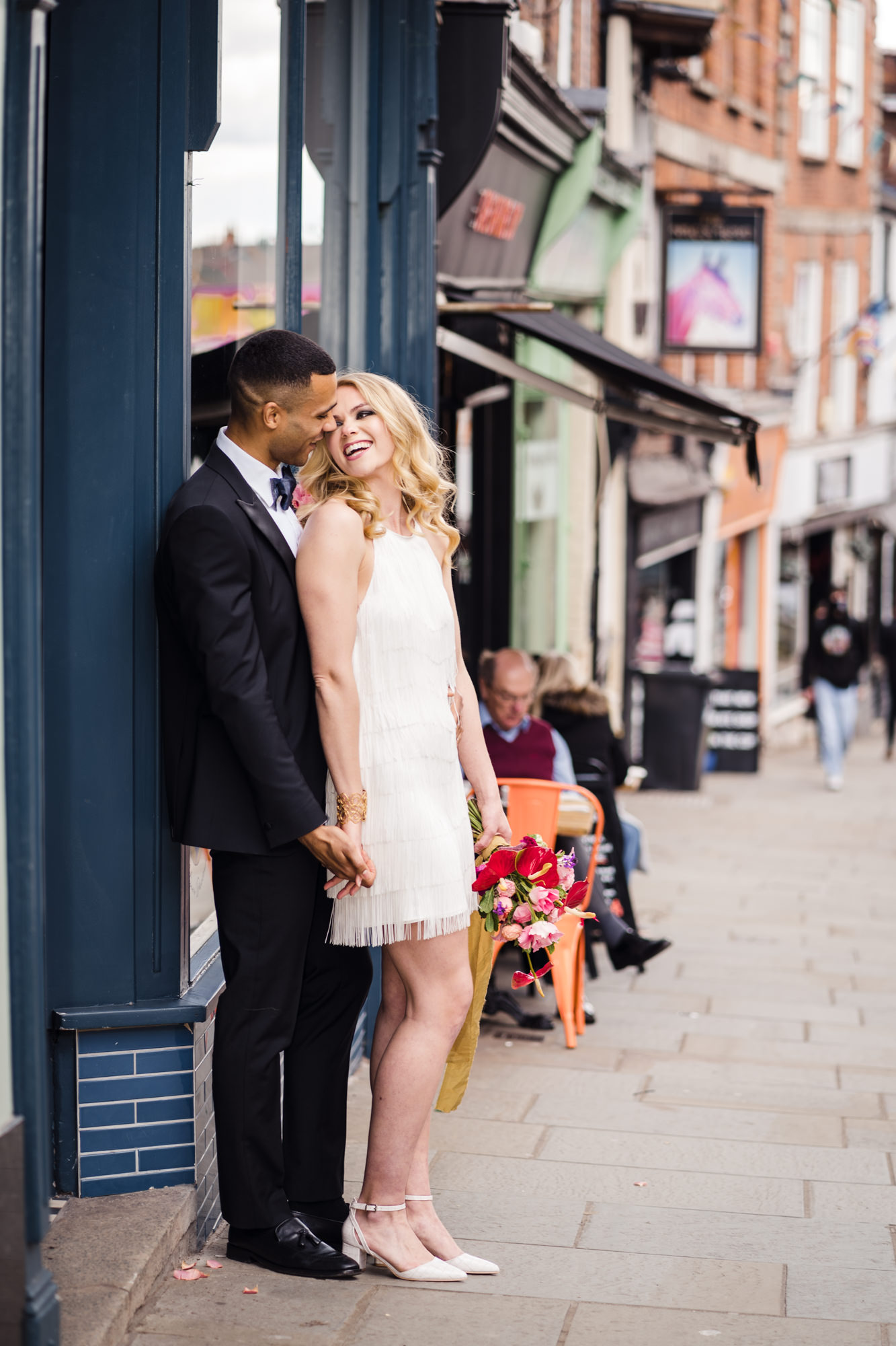 modern wedding couple portrait of bride and groom on busy city street
