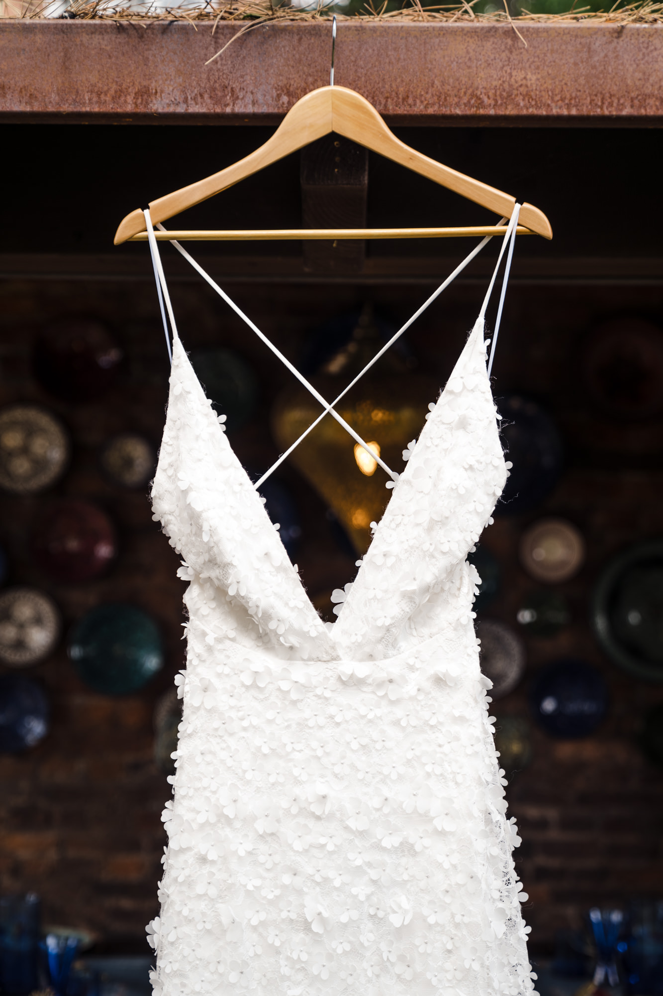 a close up photo of a Charlie Brear white wedding dress