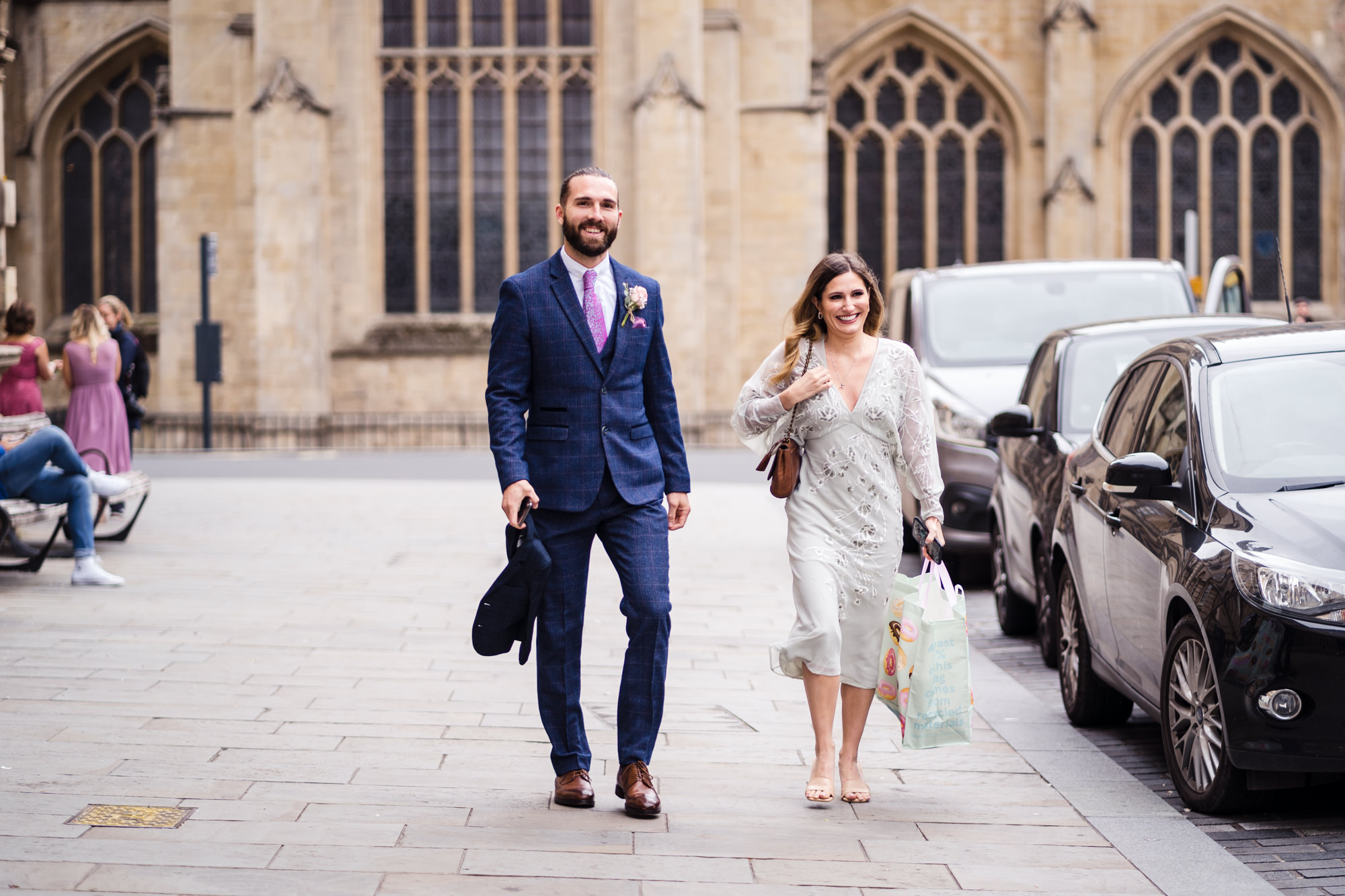 groom in blue suit arrives walking for his bath guildhall wedding