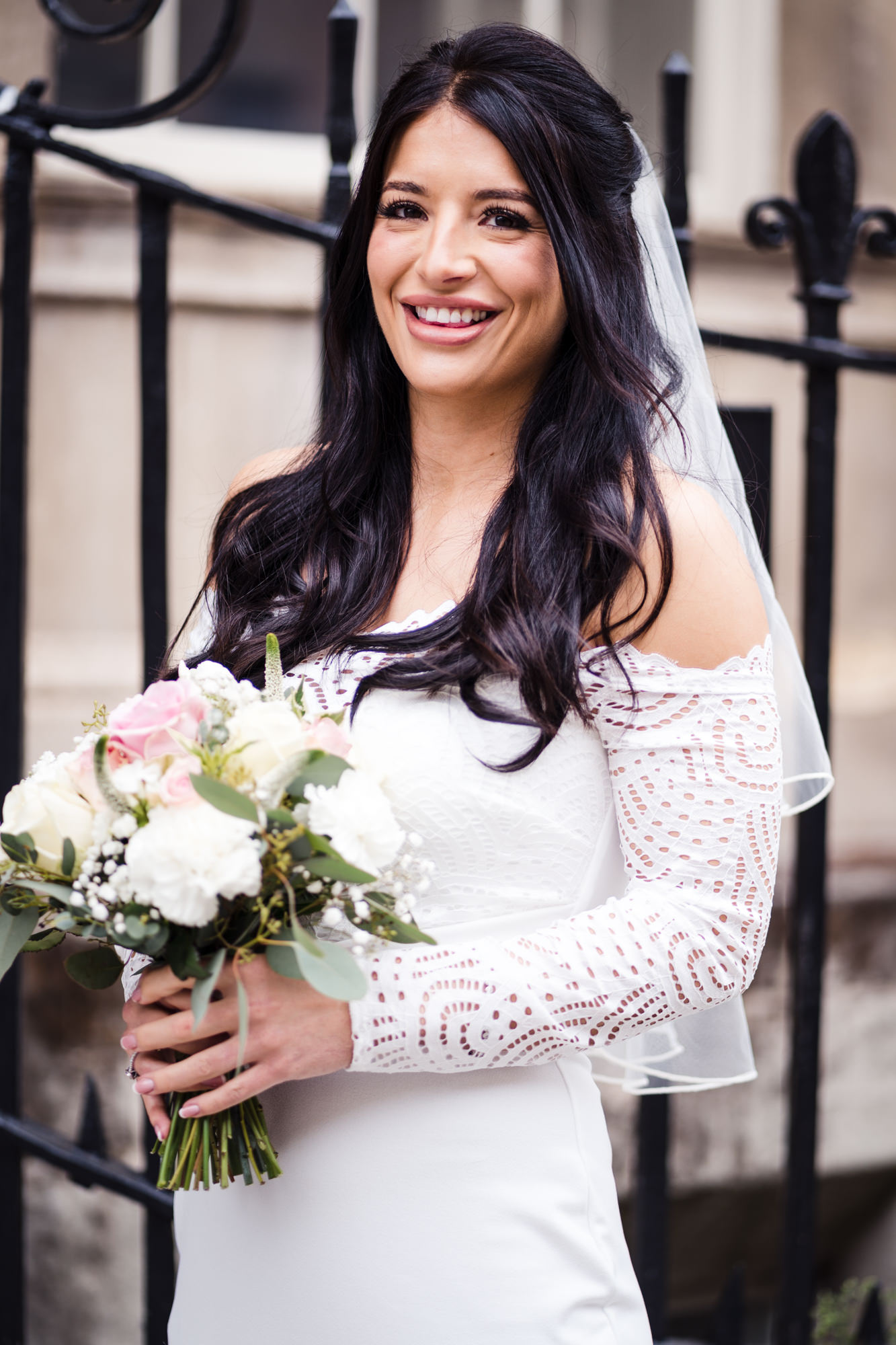 close up bridal portrait of bride in white dress outside the bath city guildhall