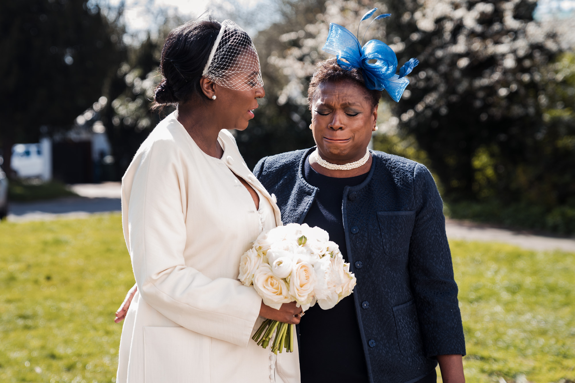 bride and mum talking before a wedding ceremony and mum is in tears